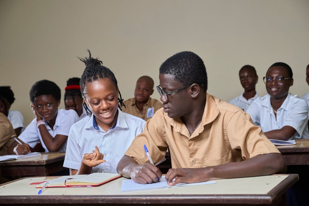Free High school students collaborating during a lesson in a classroom environment. Stock Photo